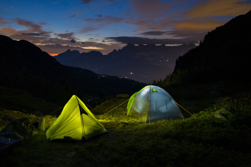 yellow tent on green grass field during daytime