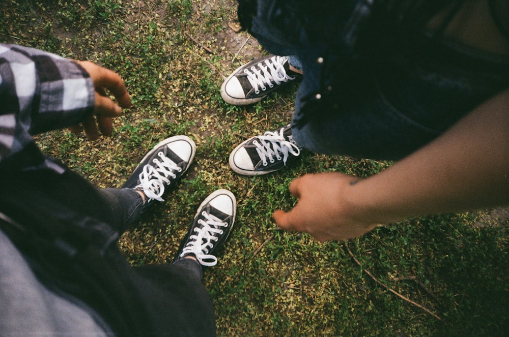 Person wearing black and white converse all star low top sneakers photo –  Free Couple Image on Unsplash