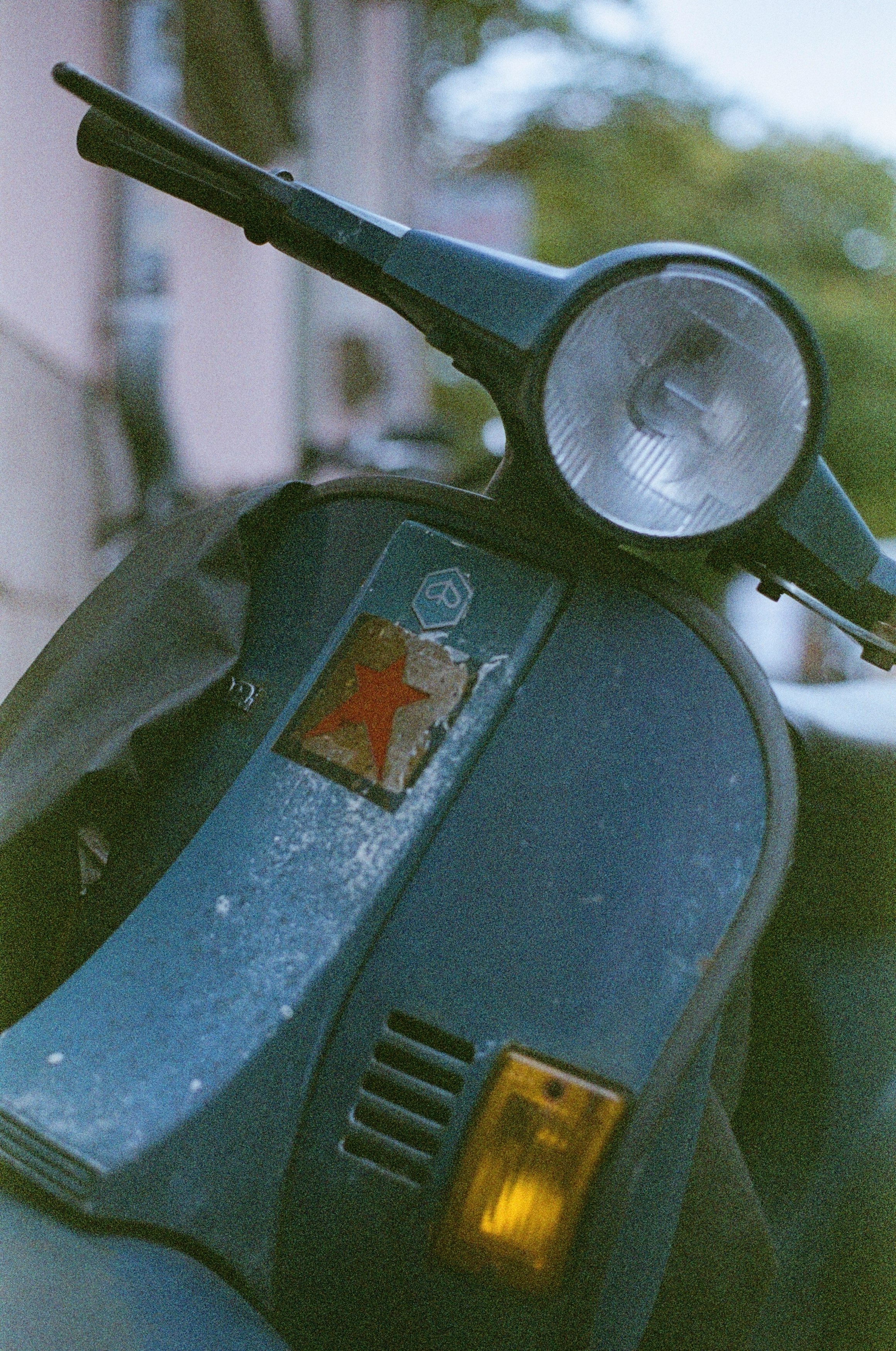 blue and black motorcycle with red and white sticker