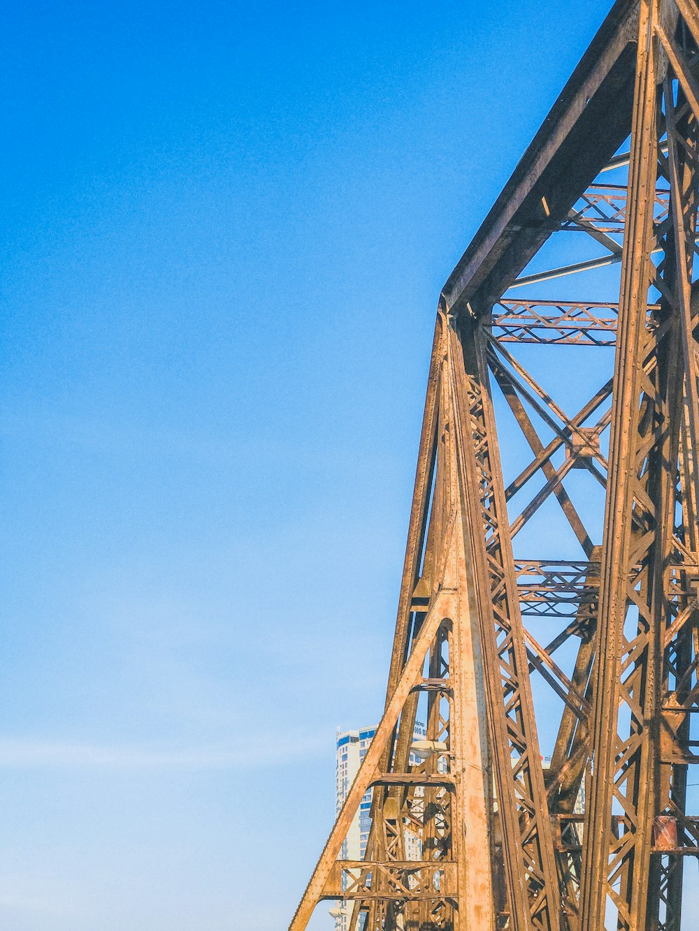 orange metal tower under blue sky during daytime