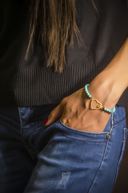 woman in blue denim jeans and black and white striped shirt