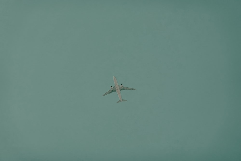 white airplane in mid air