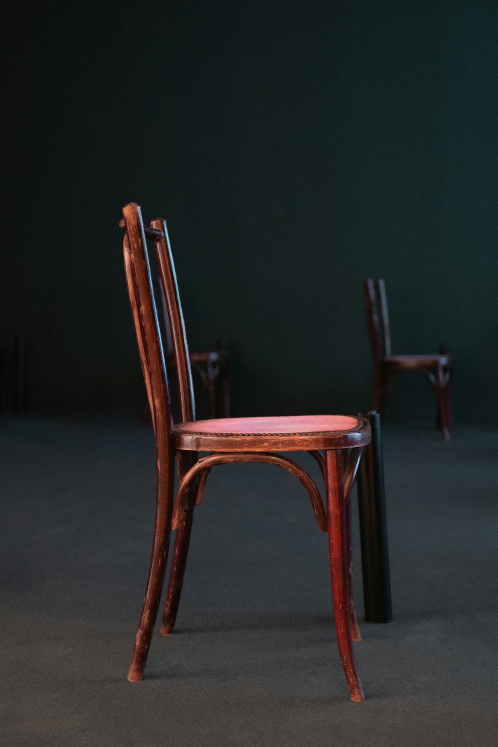 brown wooden chair on gray floor