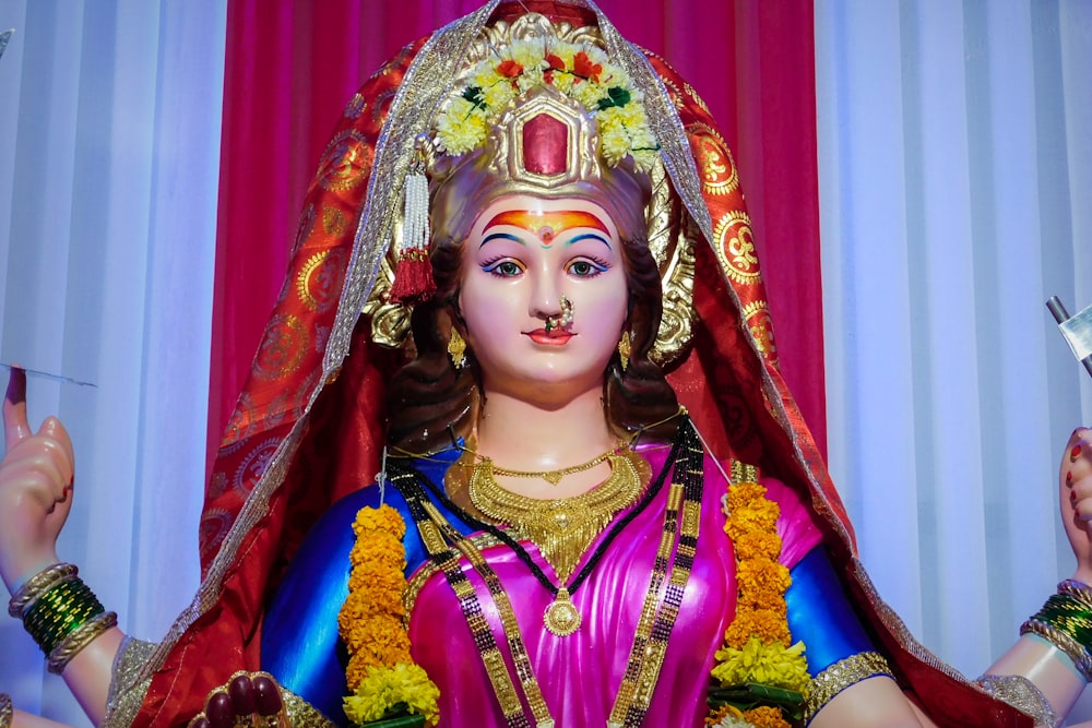 woman in red and gold sari