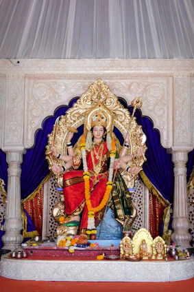 gold and red hindu deity statue