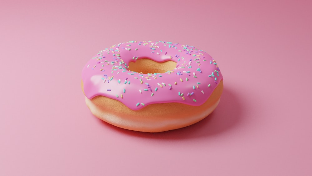 pink doughnut with pink icing on top