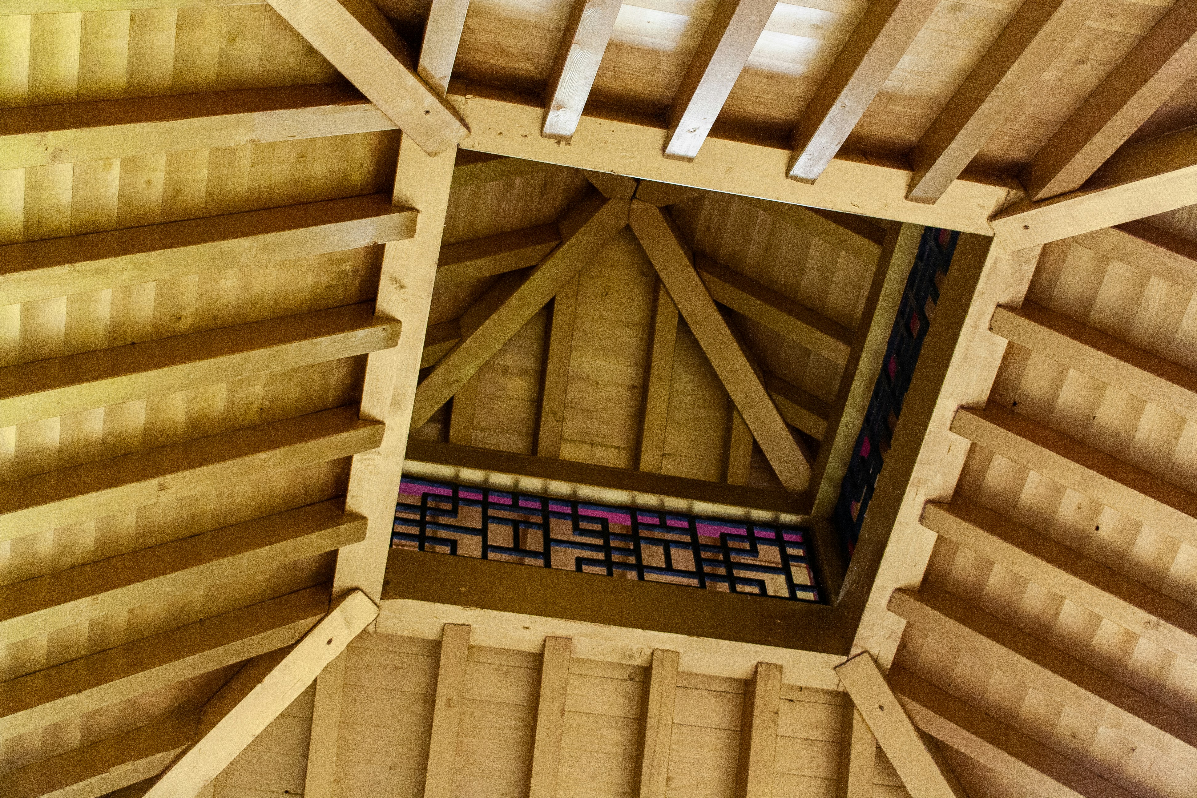brown wooden stairs with black metal railings