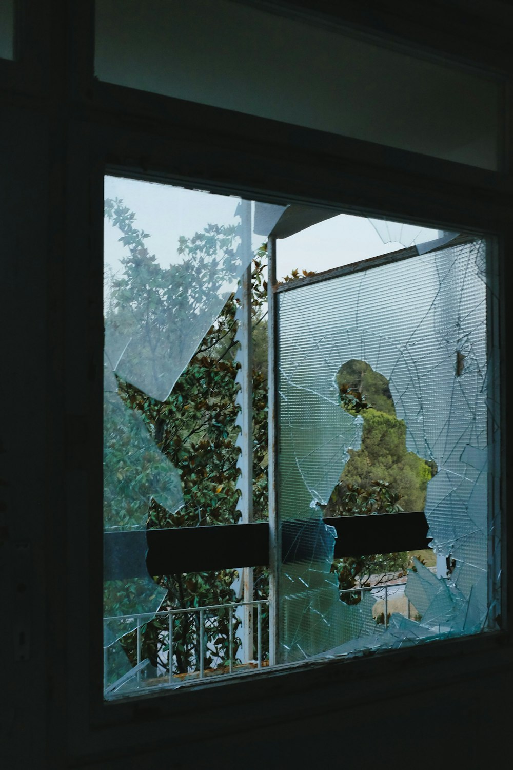 woman in yellow dress standing near window