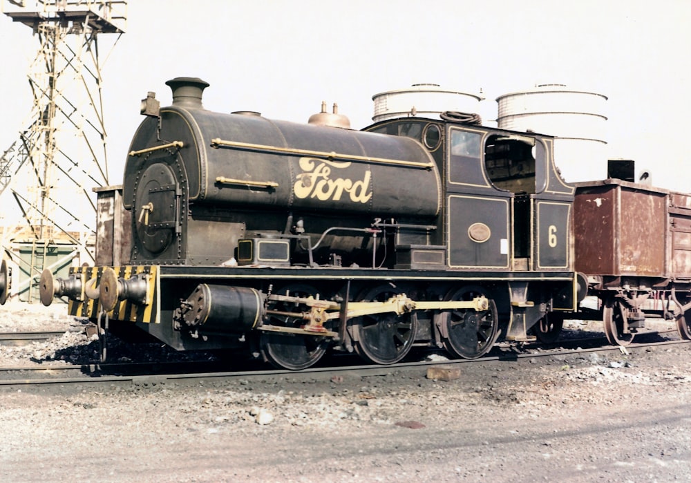 grayscale photo of train on rail tracks