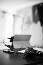 black headphones on white table