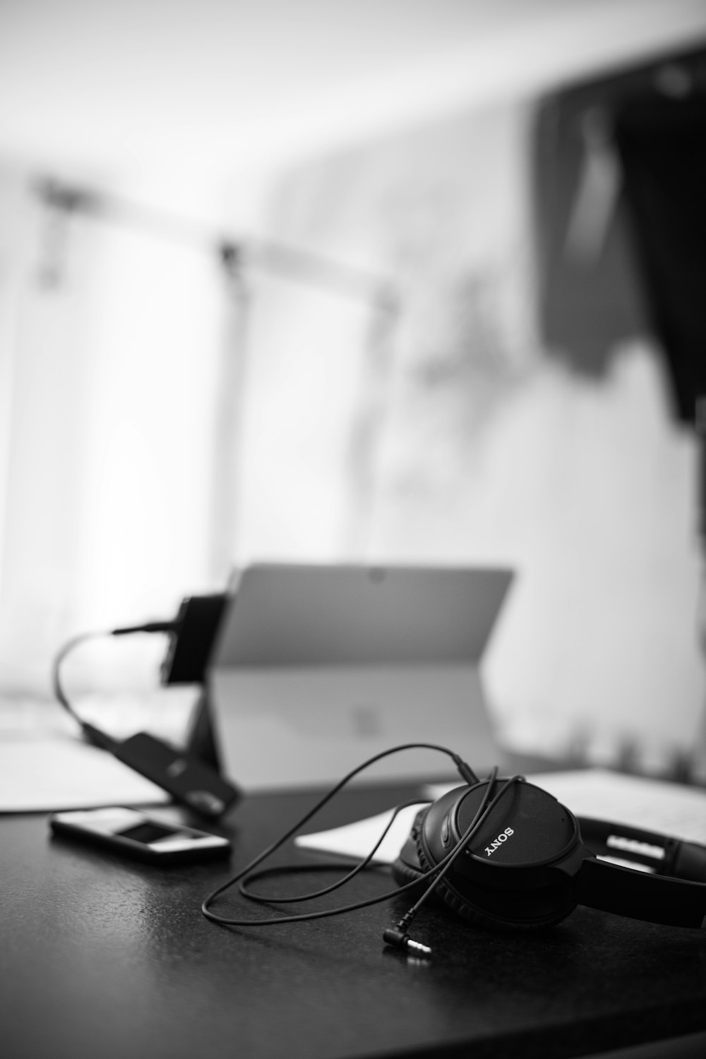 black headphones on white table