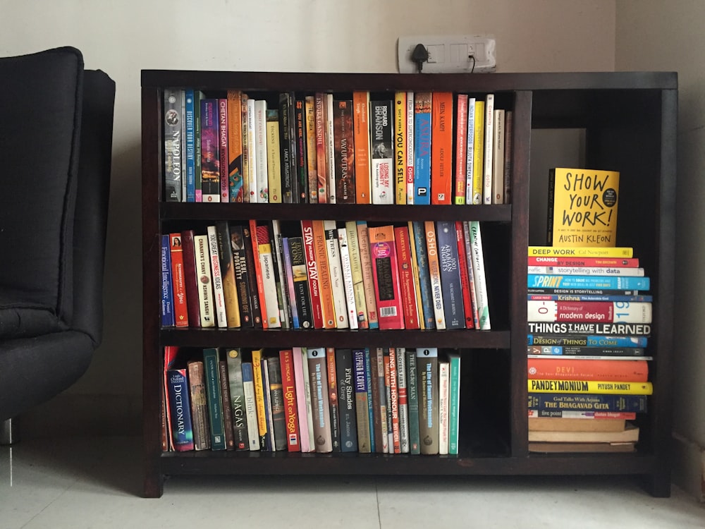 books on black wooden shelf