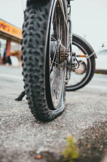 black bicycle wheel on road