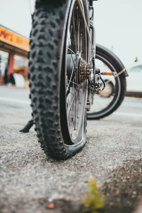 black bicycle wheel on road