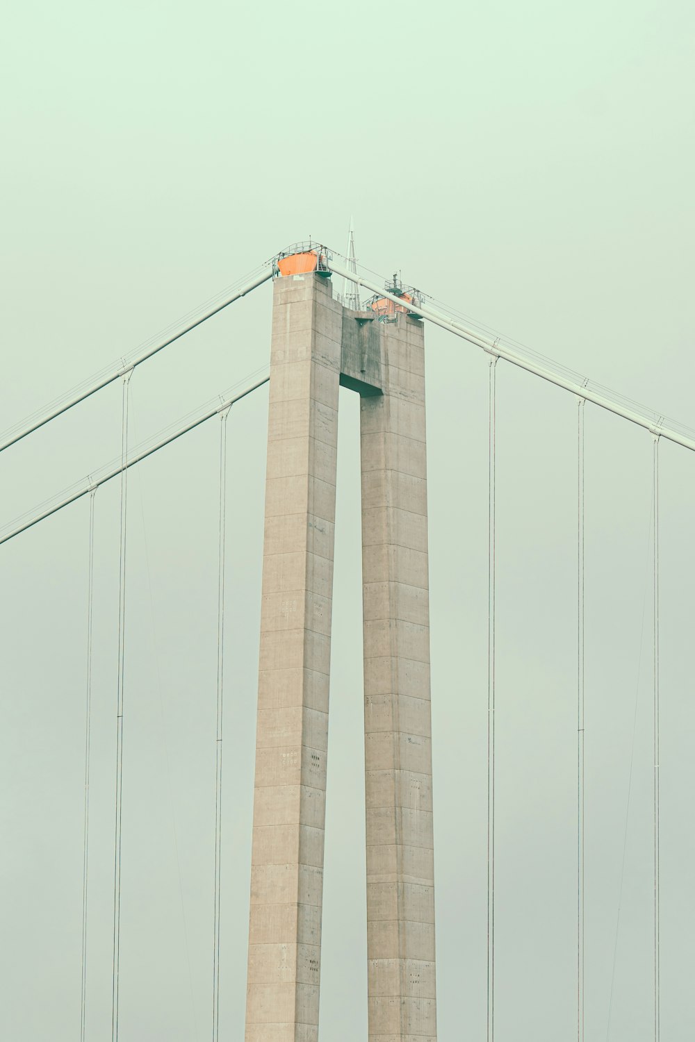 brown concrete bridge under white sky during daytime