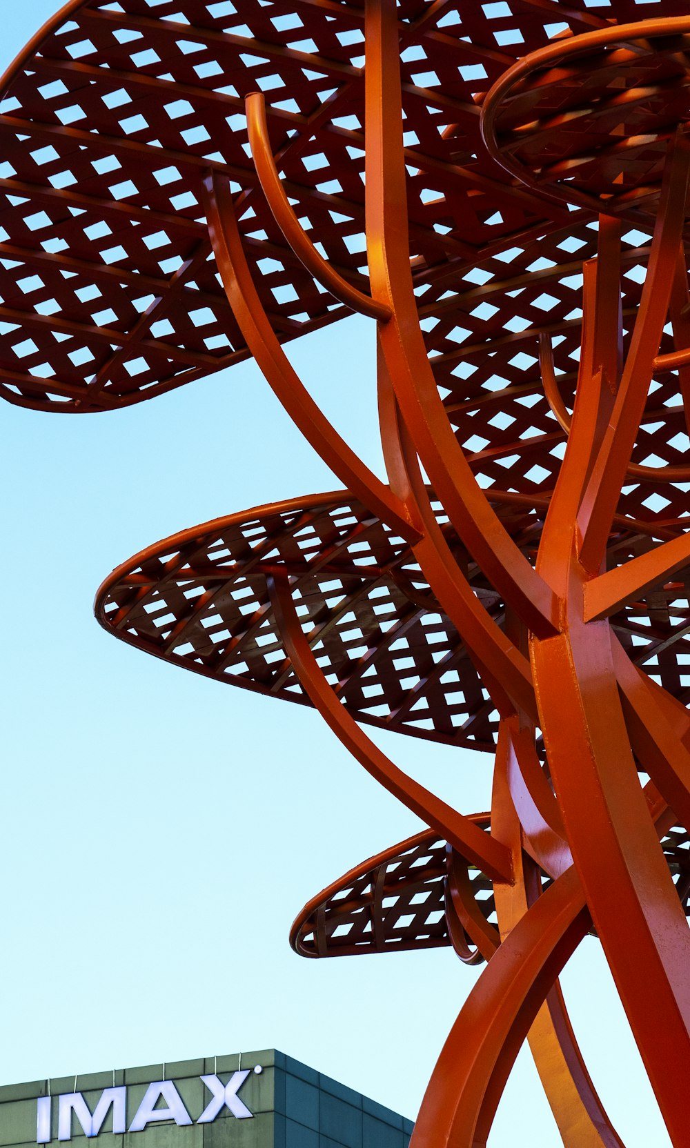 red spiral stairs under white sky