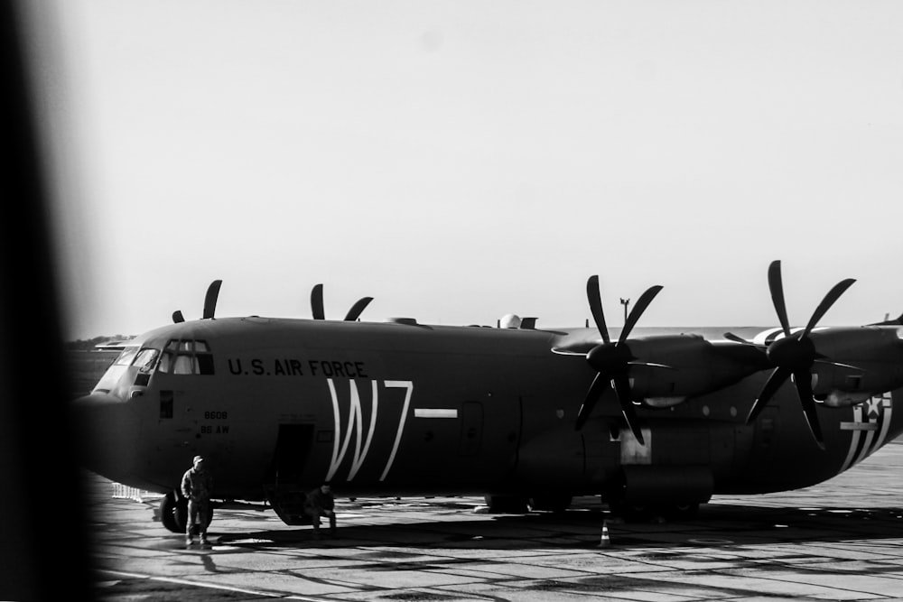 black and white jet plane on the road during daytime