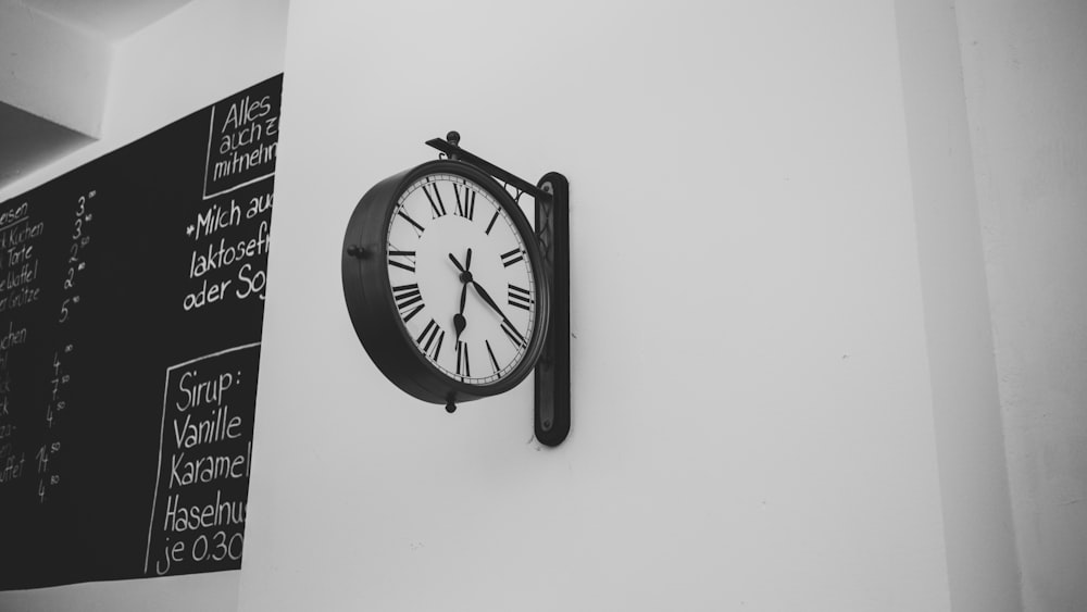 black and white analog wall clock