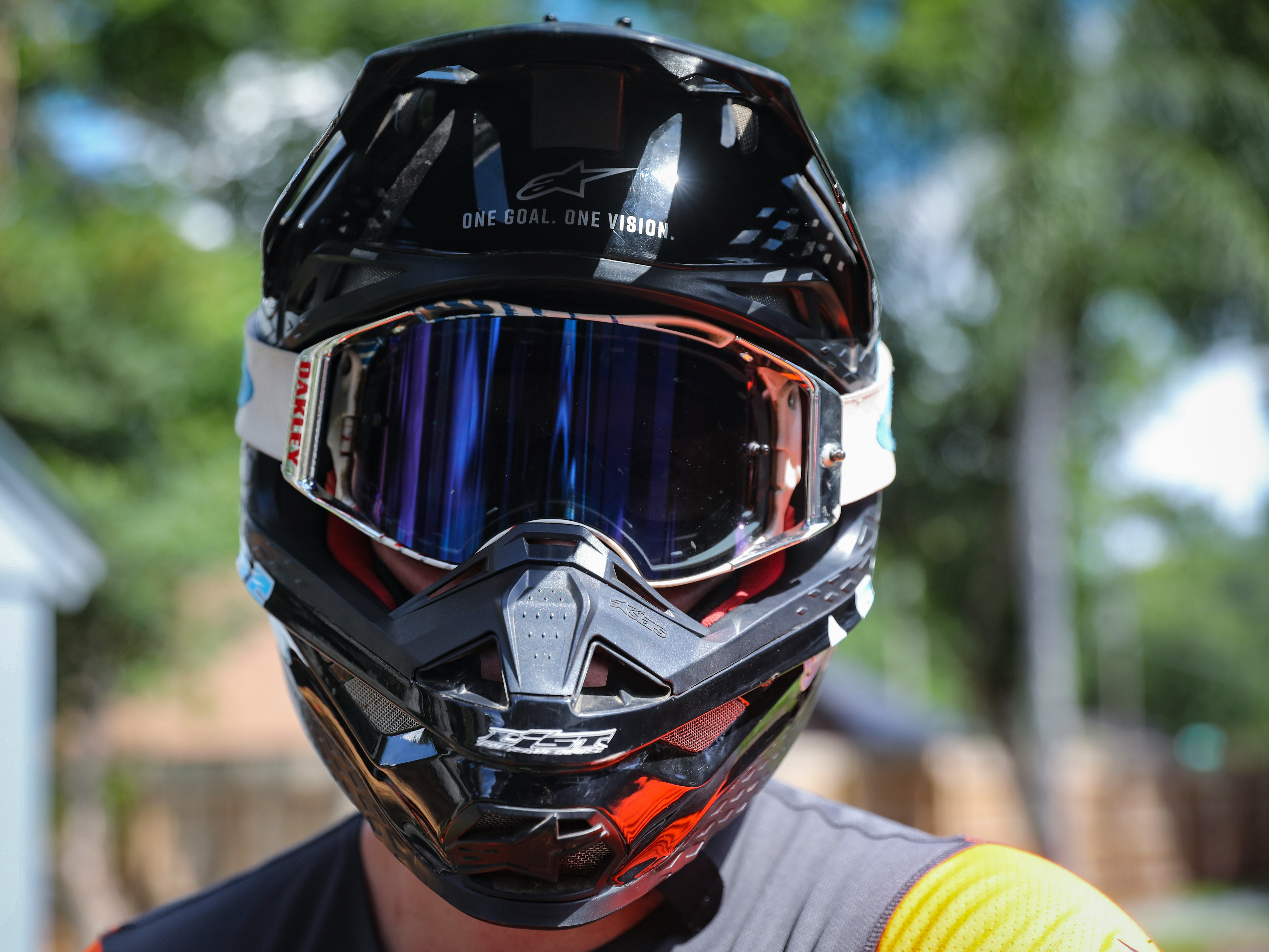 person in black and red motorcycle helmet