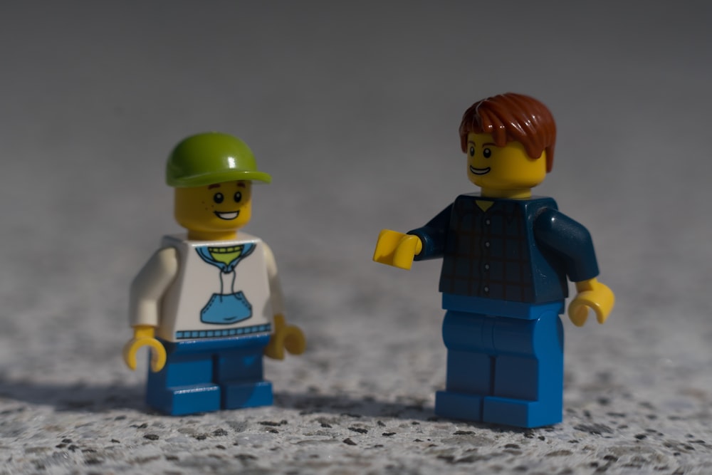 boy in blue and black vest lego
