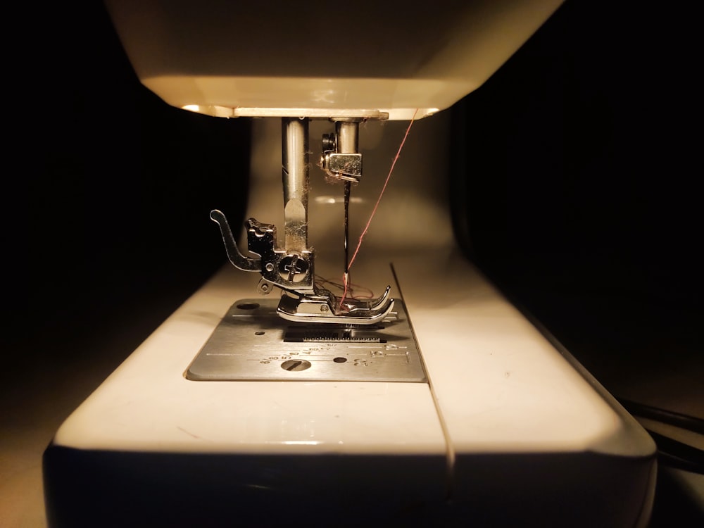 white sewing machine sewing machine