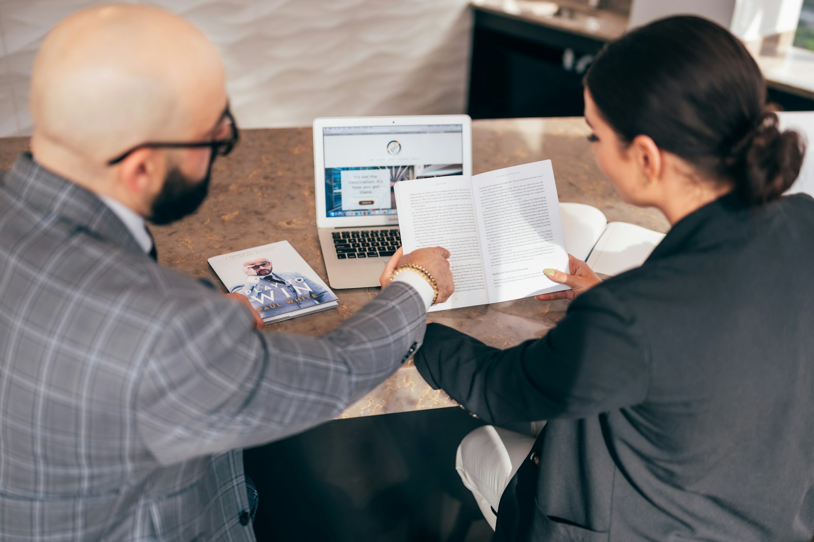 A professional reviewing printed content pages