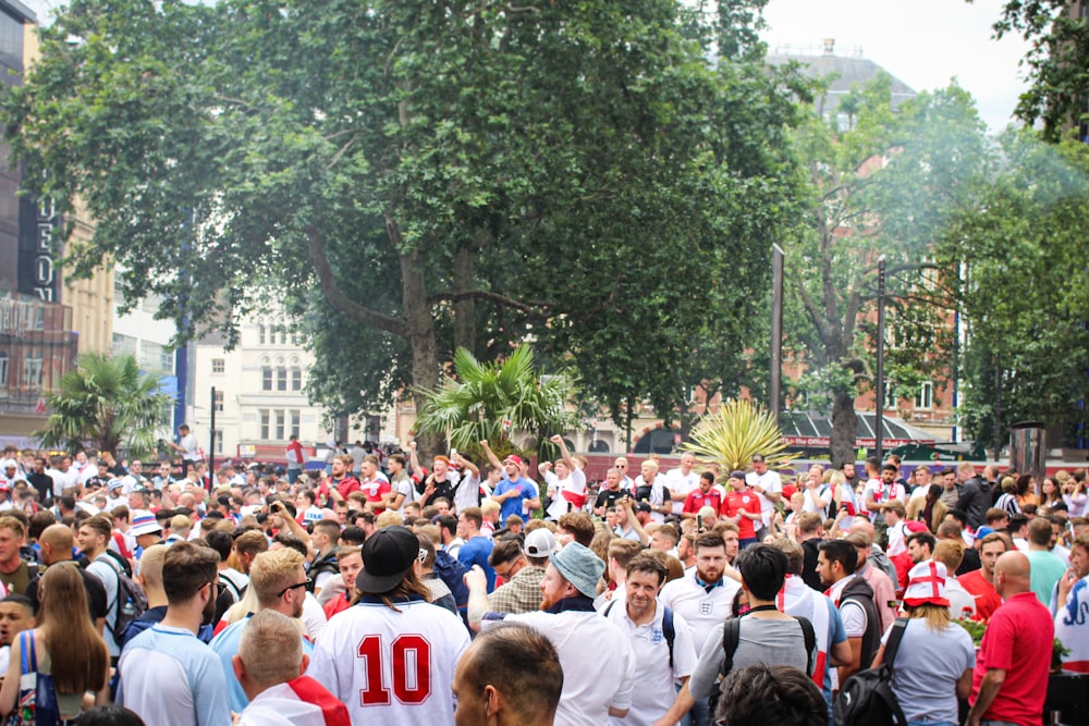 people gathering on a street during daytime