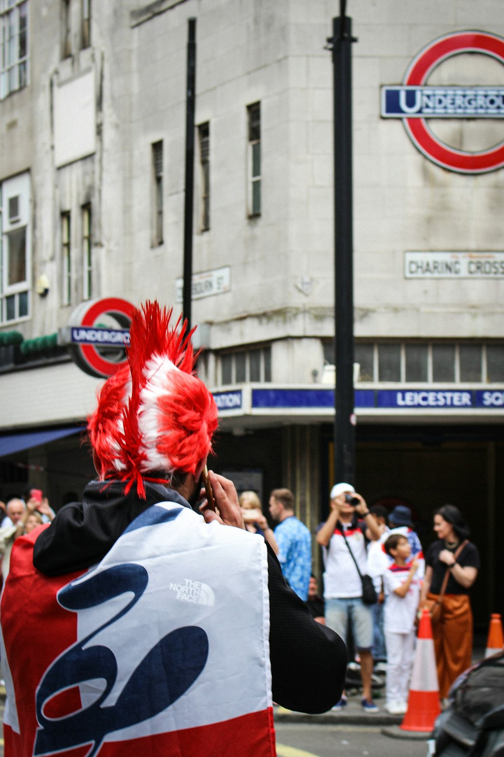 people in white shirt and red wig standing on street during daytime