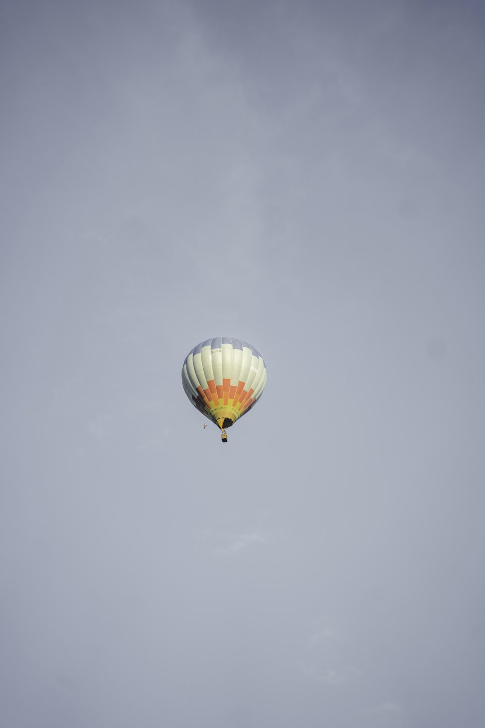 red yellow and blue hot air balloon in the sky