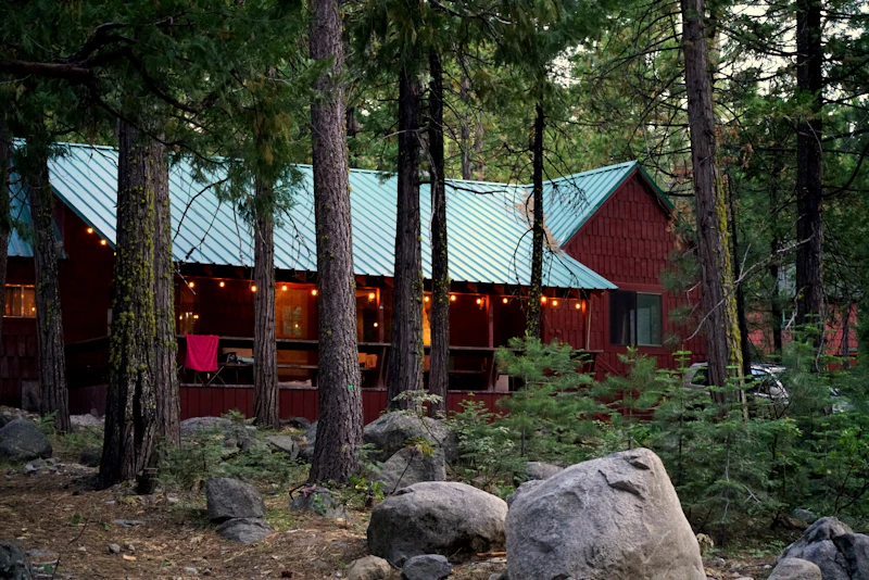 Cozy wooden camp cabins nestled among the trees