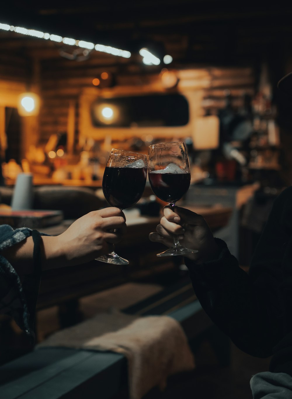 person holding clear wine glass