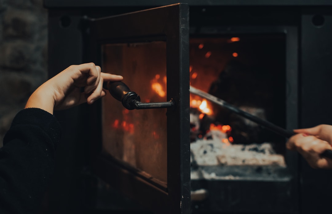 person holding black metal tool