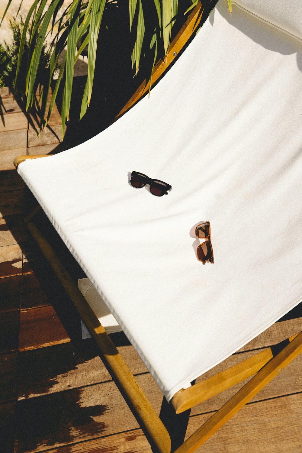 black sunglasses on white table cloth