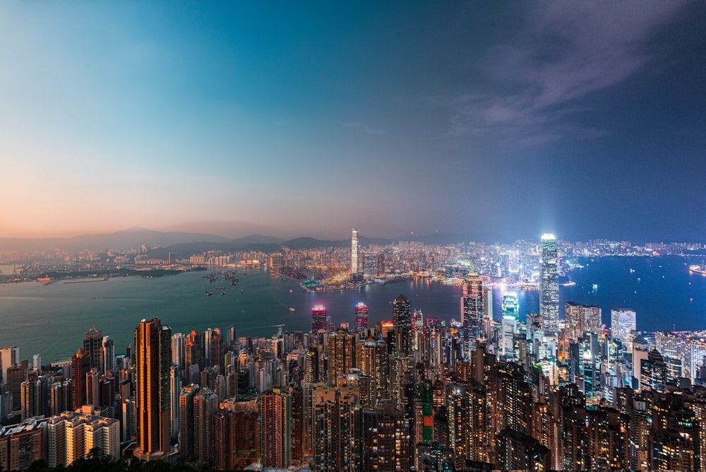 a view of a city at night from the top of a hill