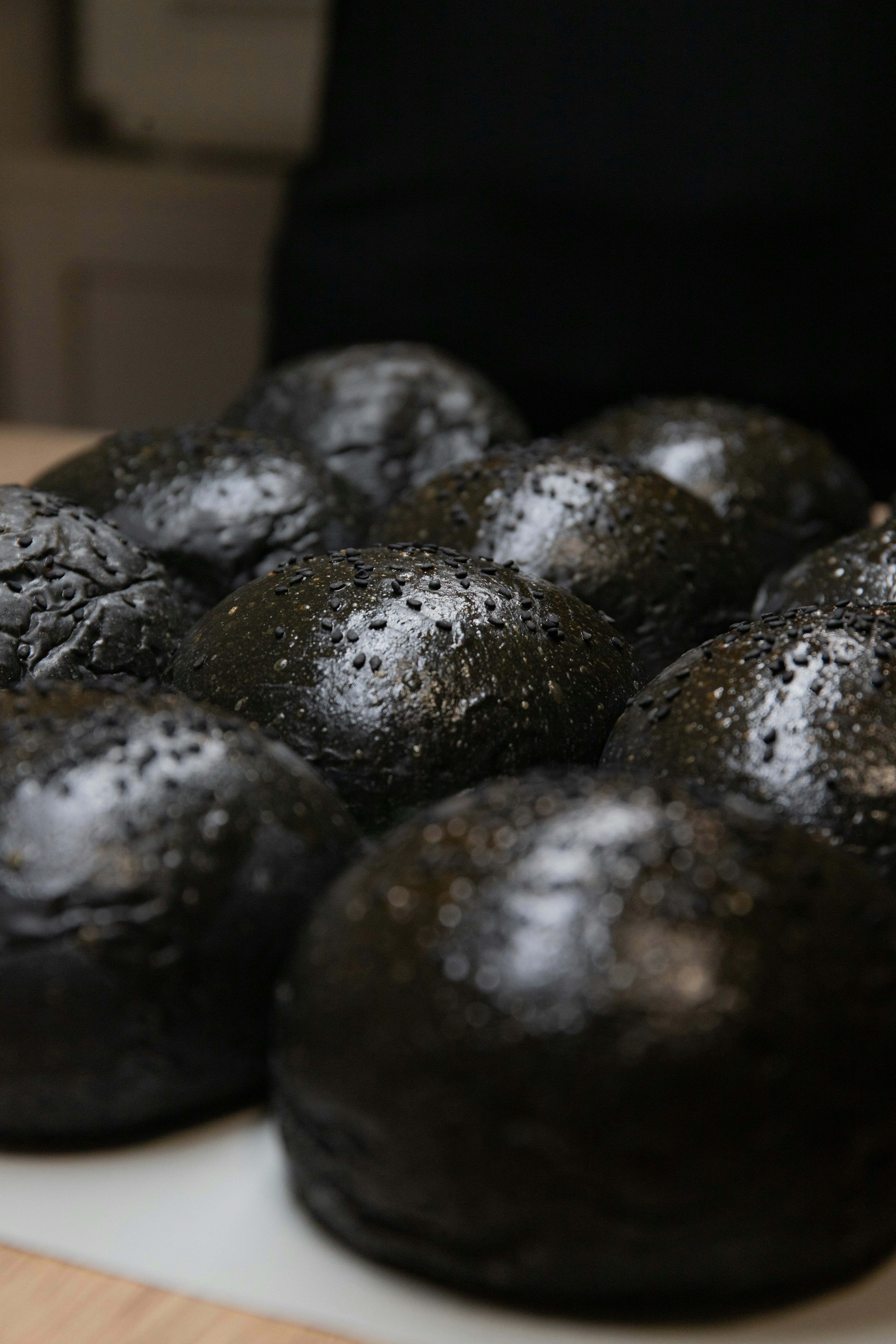 black round fruit on white table
