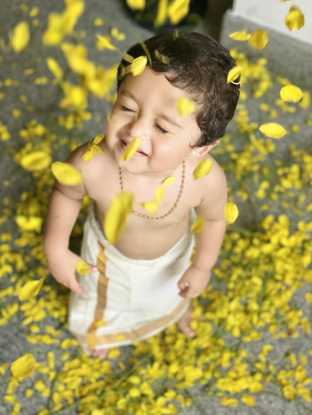 girl in white dress on yellow flower field during daytime