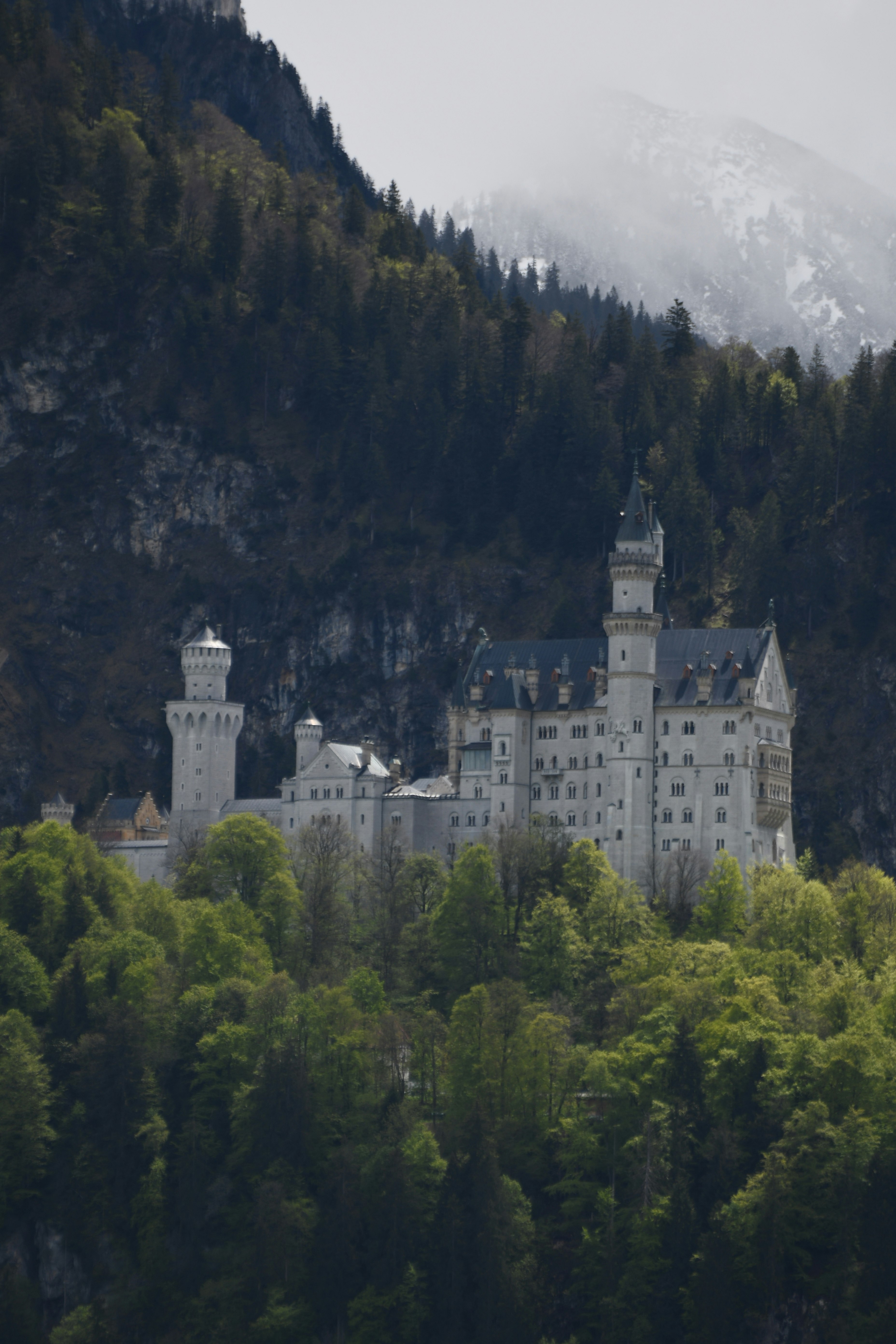 white concrete castle on top of mountain