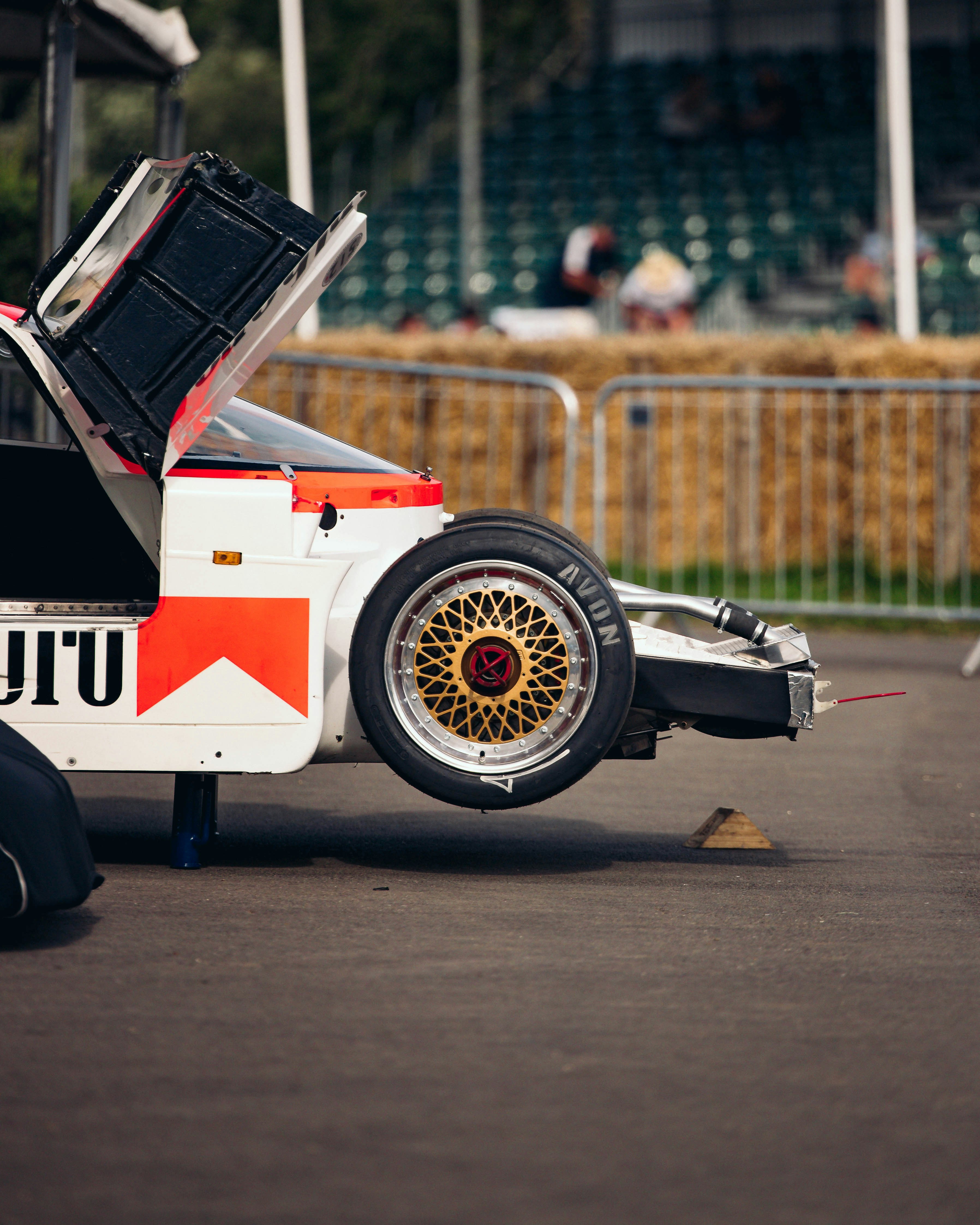 black and white racing car on track field during daytime
