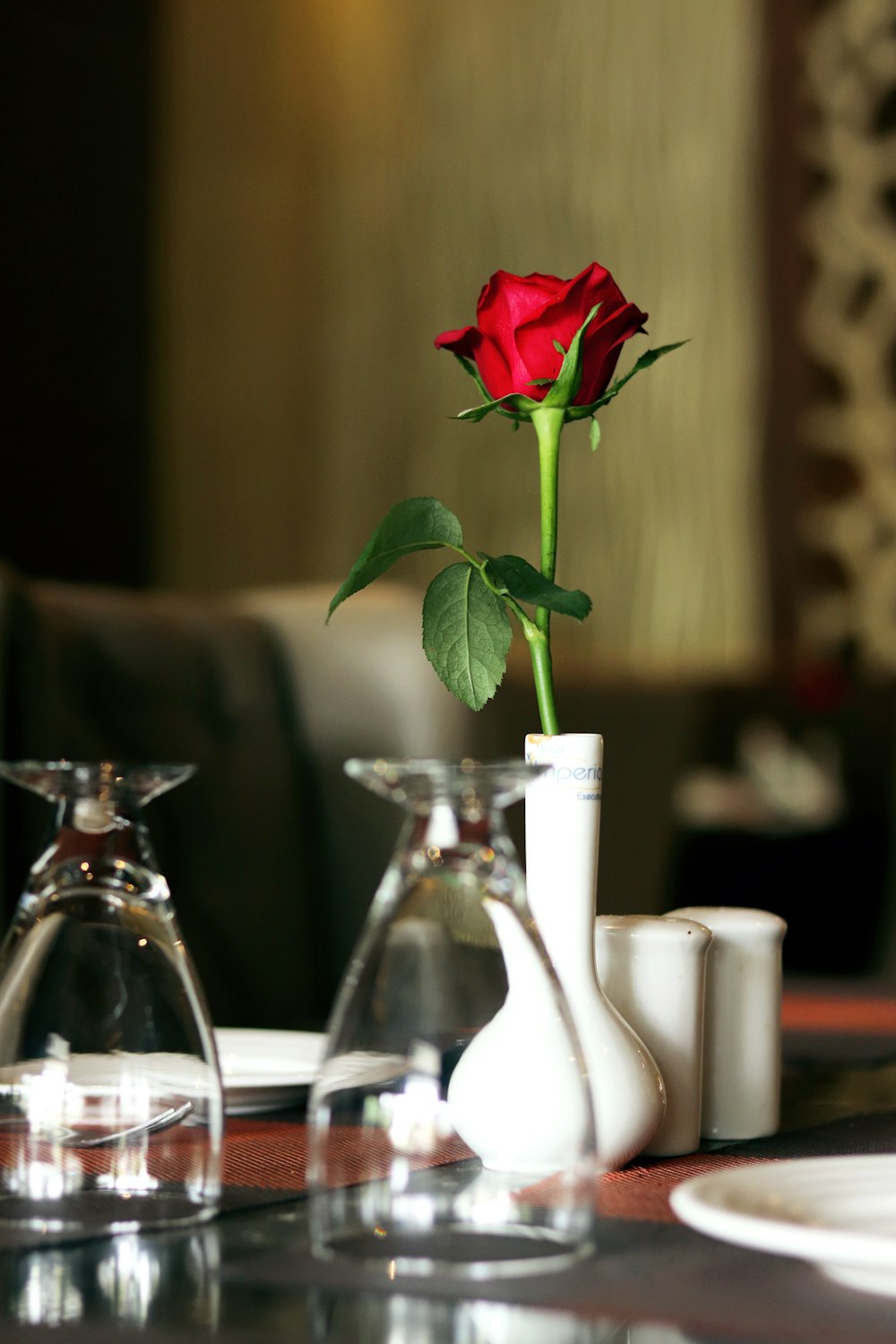 red rose in clear glass vase