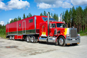 red and white truck on road during daytime