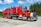 red and white truck on road during daytime