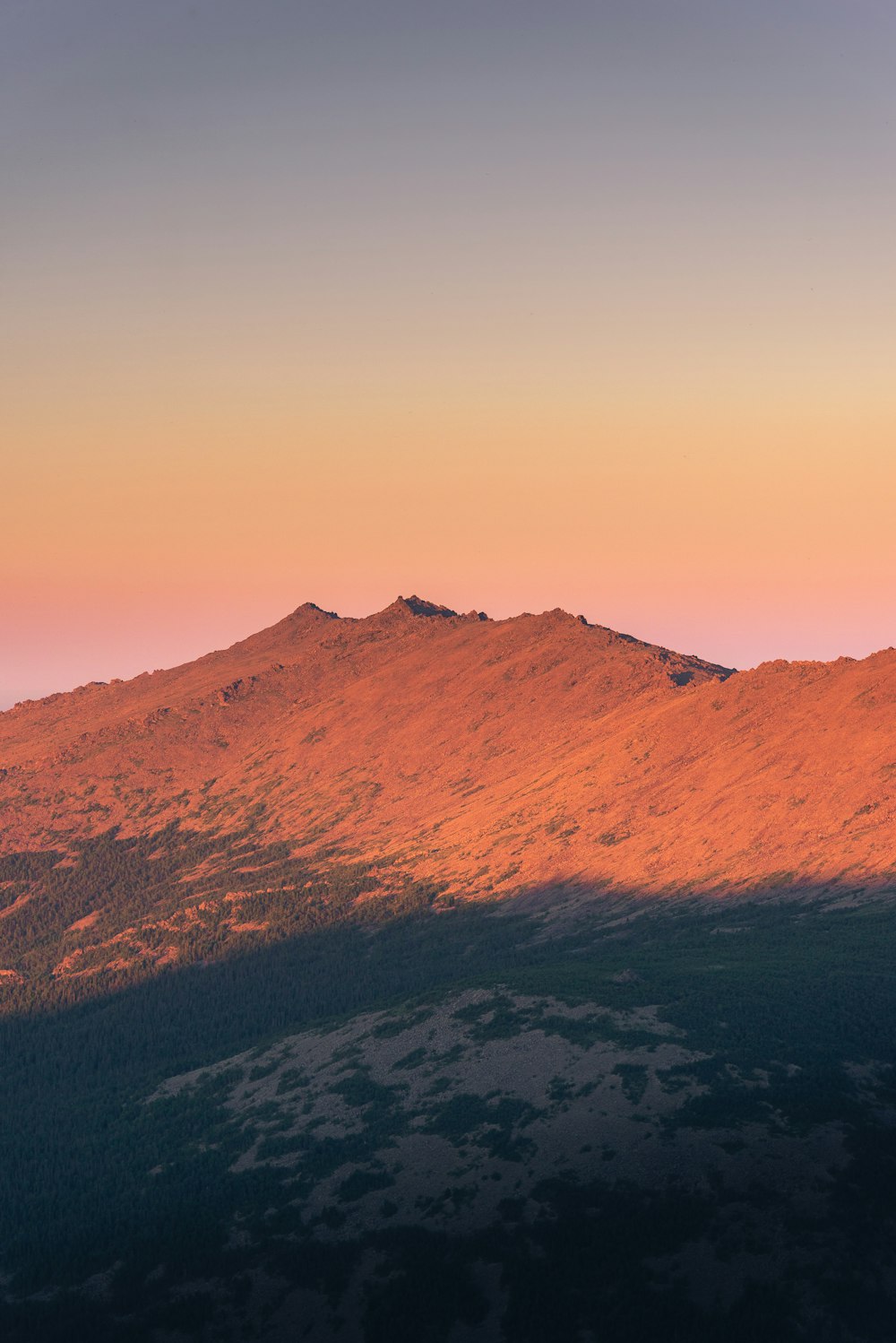 brown mountain under blue sky during daytime