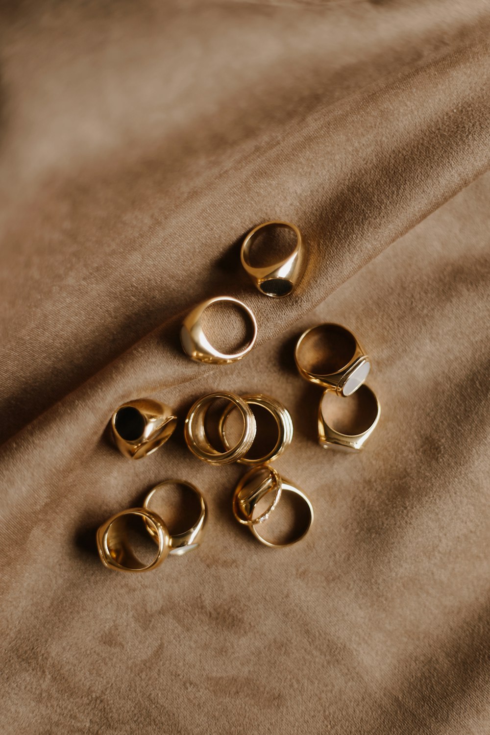 gold rings on gray textile