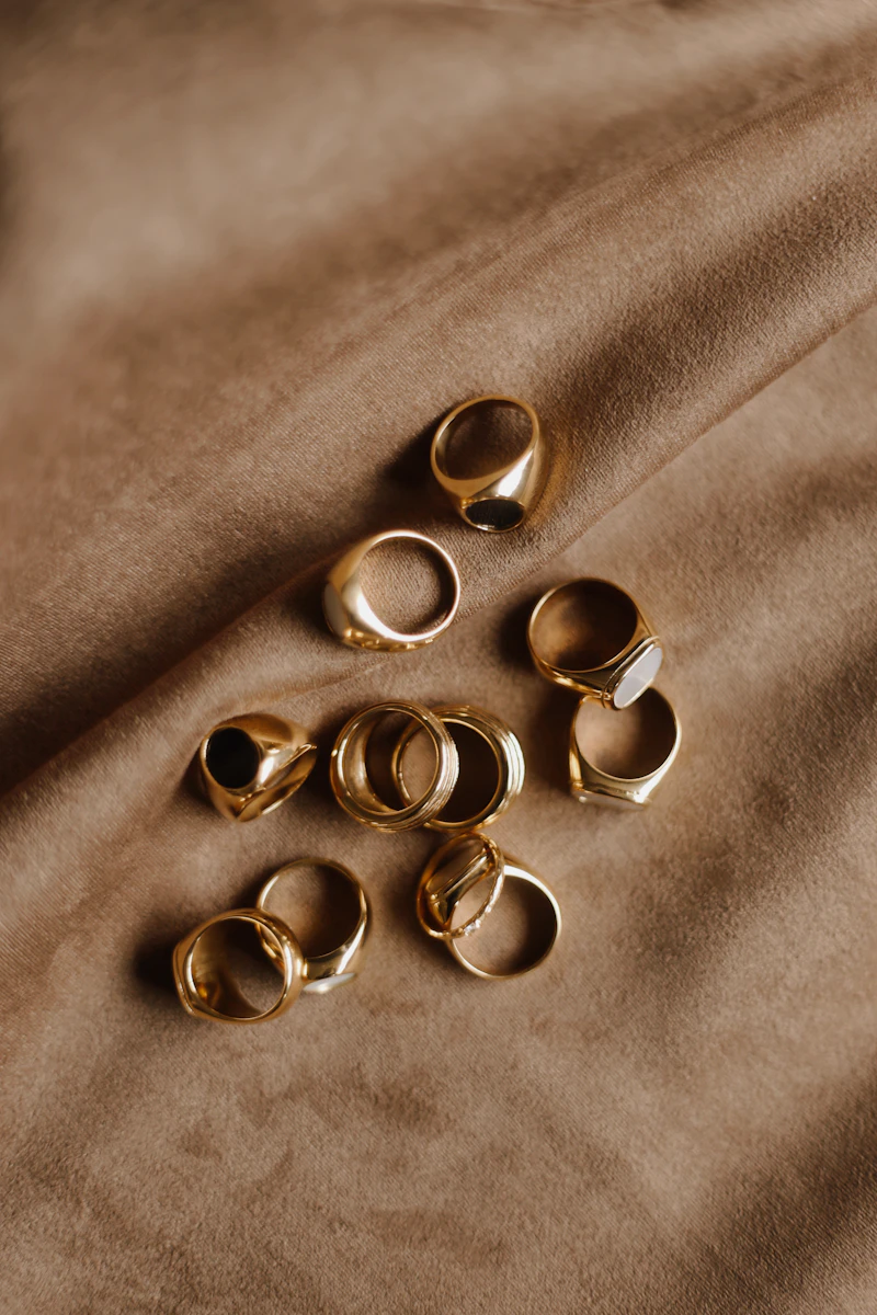 Gold jewelry and accessories flat lay