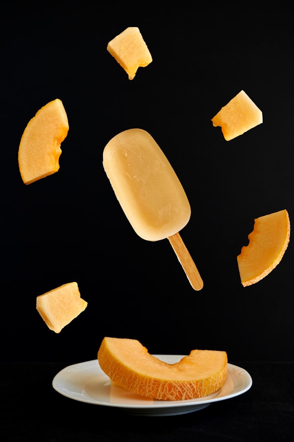 Yellow ice pop on black textile