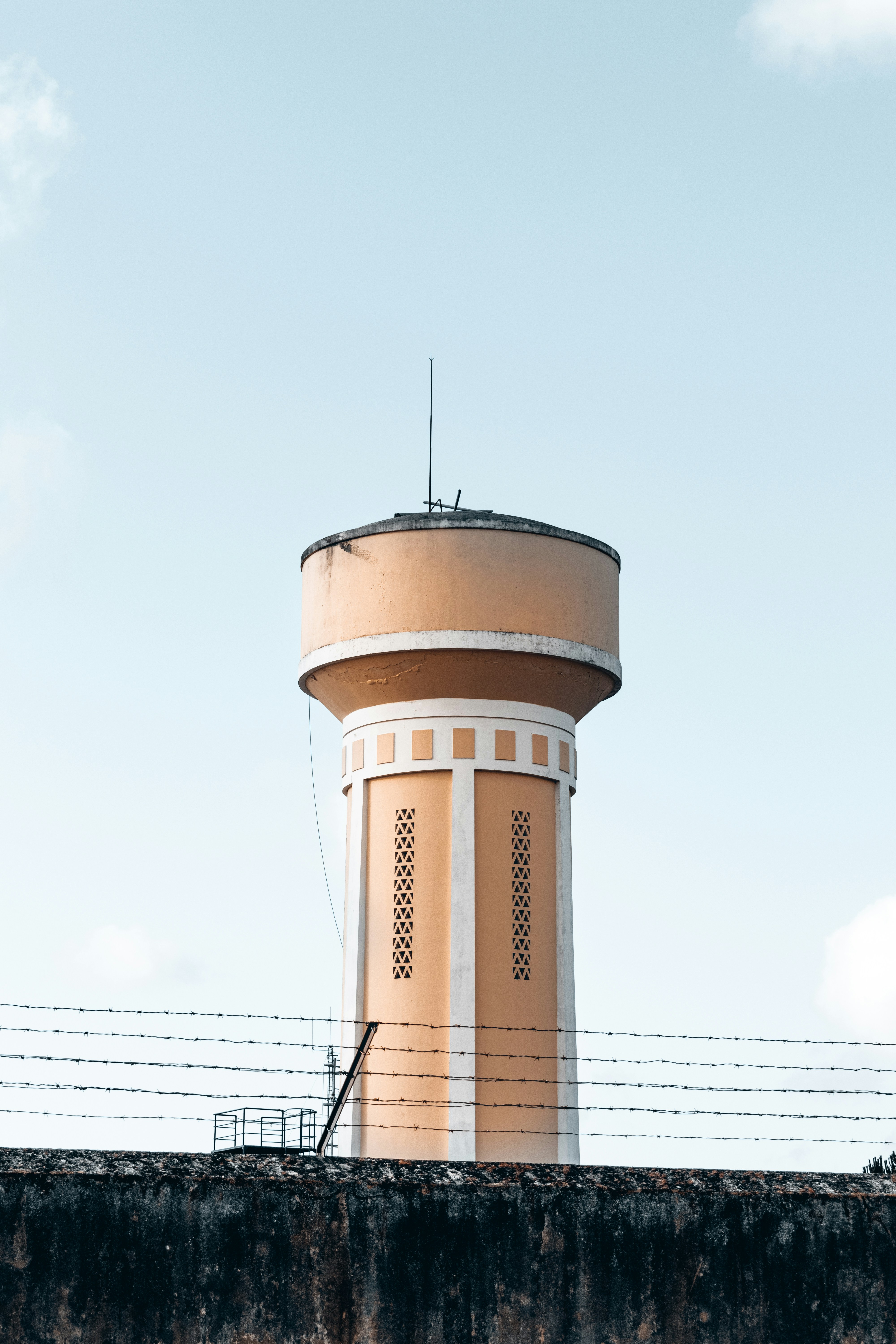 brown and white concrete building under white sky during daytime