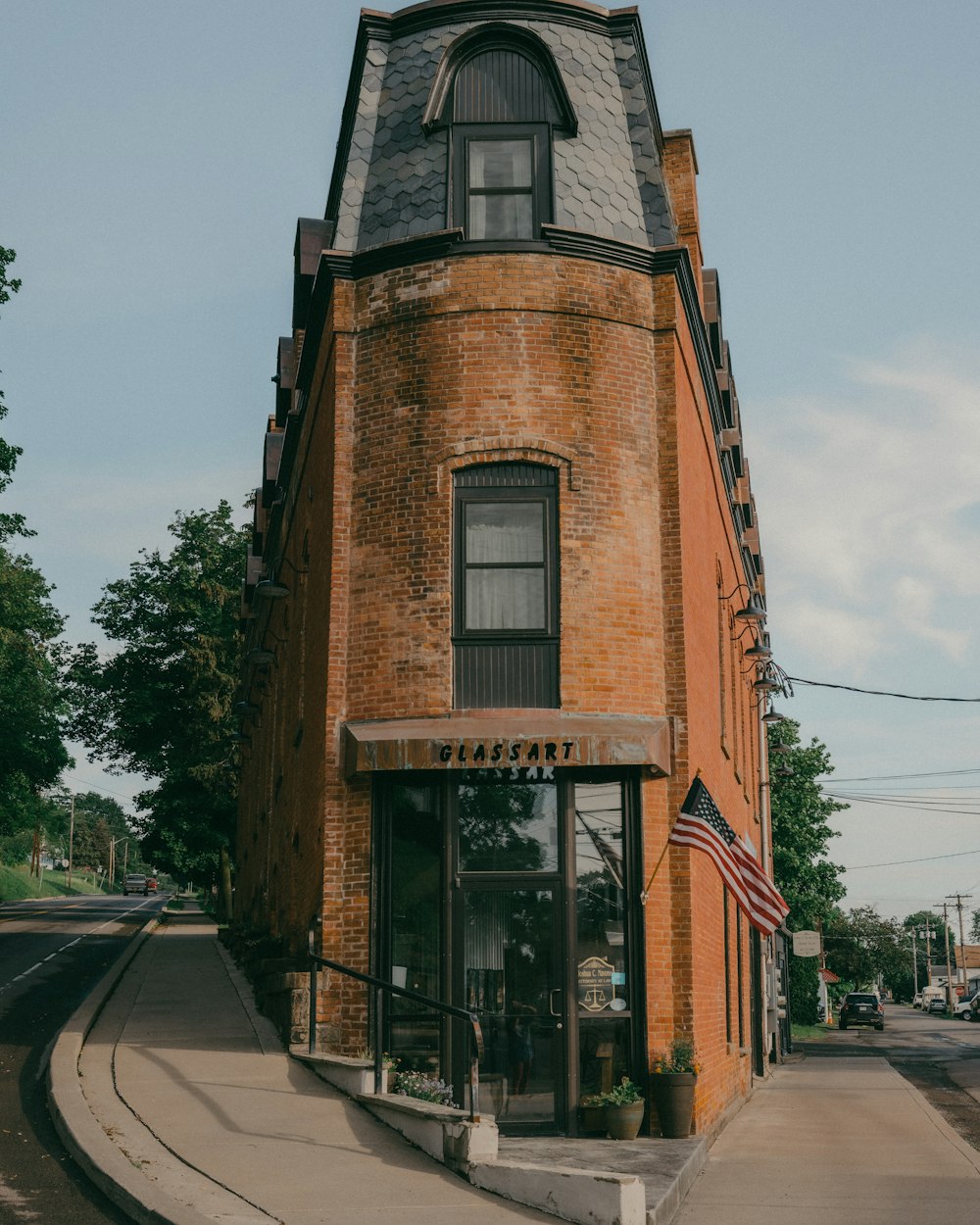 brown brick building near road during daytime