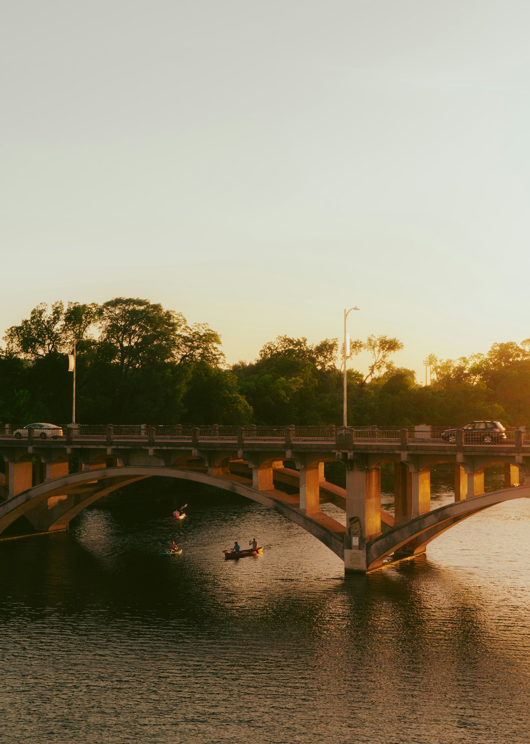 brown concrete bridge over river during daytime