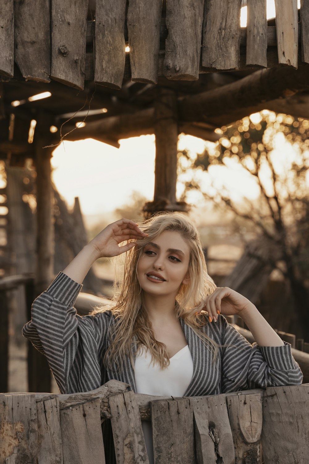 woman in black and white striped long sleeve shirt