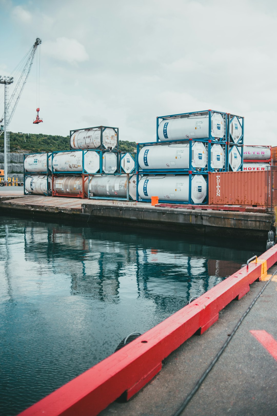 red and gray metal containers on dock